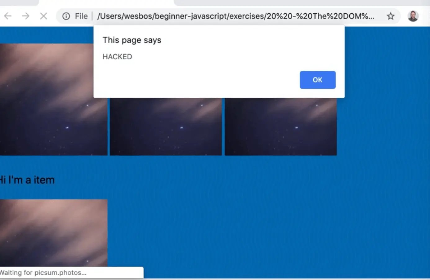 webpage with active alert saying HACKED